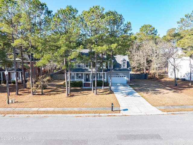 view of front of property featuring covered porch and a garage