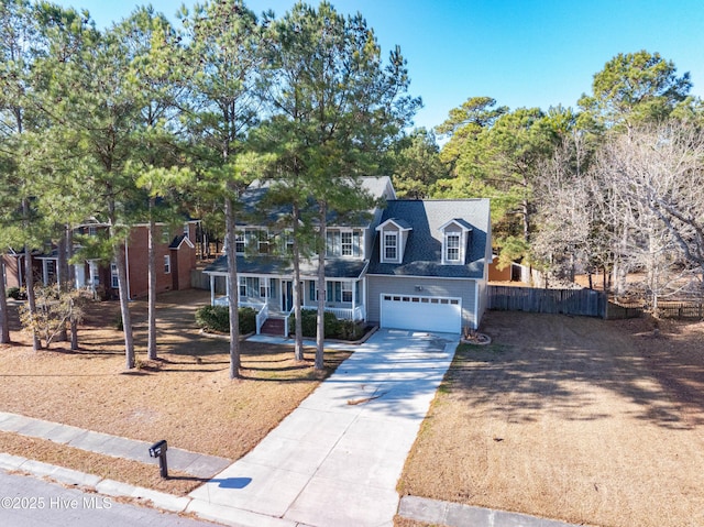 view of front of house featuring a porch and a garage