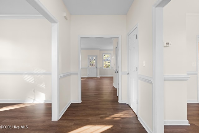 hallway with dark hardwood / wood-style flooring