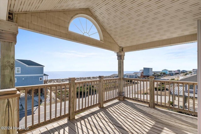 wooden deck with a water view