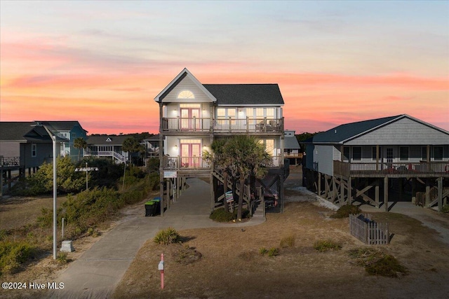 view of front of home featuring a carport and a balcony