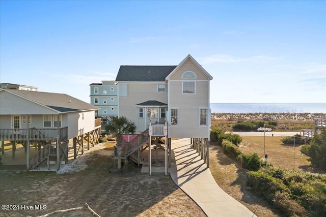 view of front facade with a water view and a carport