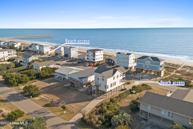 aerial view featuring a water view and a view of the beach