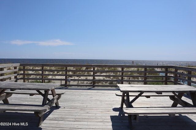 wooden deck featuring a water view