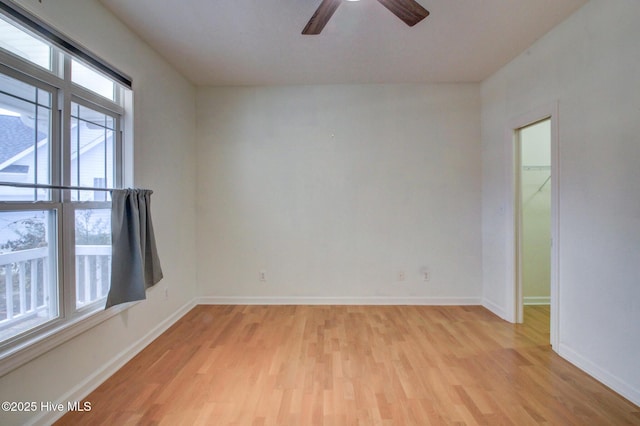 spare room with ceiling fan and light hardwood / wood-style floors