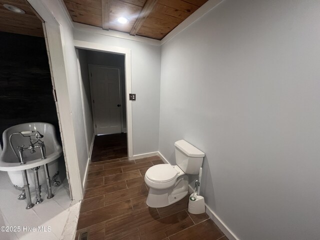 bathroom featuring a shower with shower door, vanity, wooden ceiling, and wooden walls