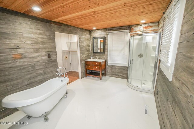 unfurnished room featuring dark hardwood / wood-style floors, ceiling fan, and a wealth of natural light