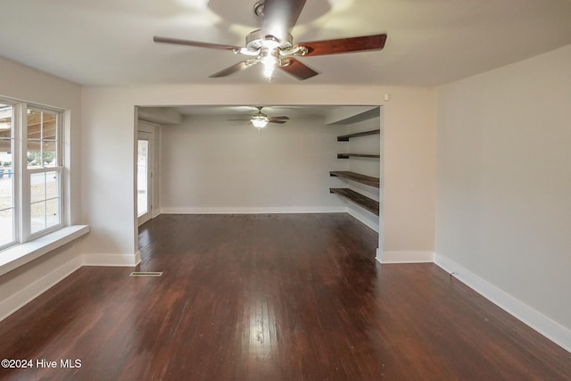 empty room featuring dark wood-type flooring