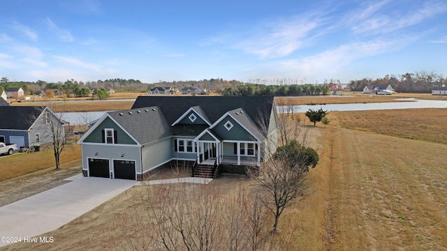 view of front of home with covered porch and a garage