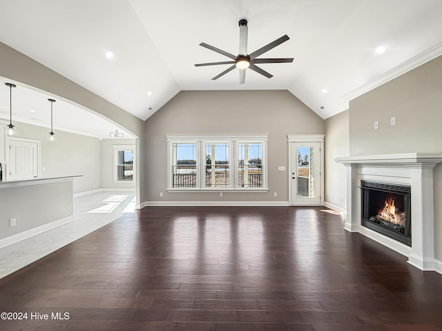 unfurnished living room featuring dark hardwood / wood-style floors, ceiling fan, and high vaulted ceiling