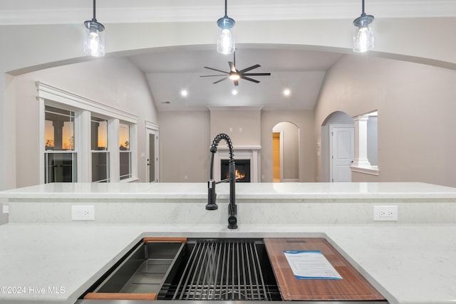 kitchen featuring lofted ceiling and decorative light fixtures