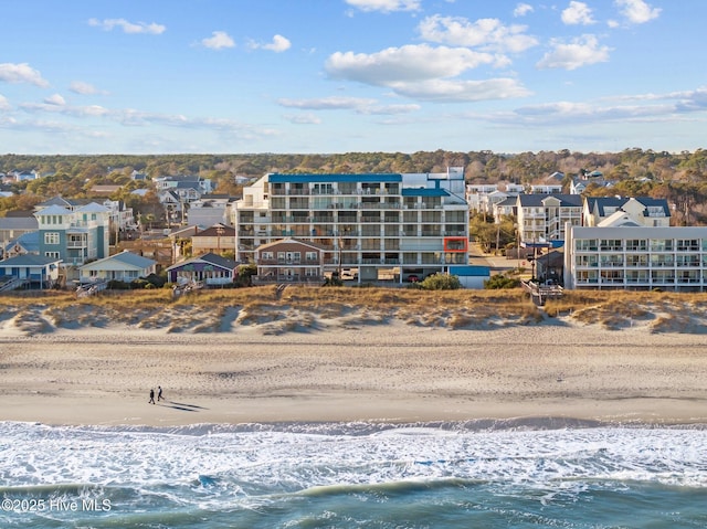 aerial view with a water view and a view of the beach