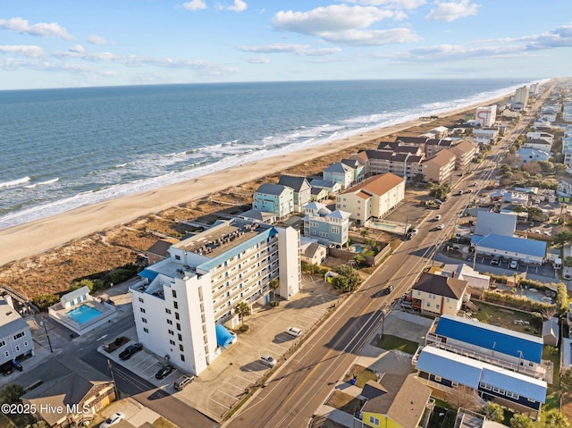 aerial view featuring a view of the beach and a water view