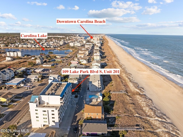 bird's eye view with a water view and a view of the beach