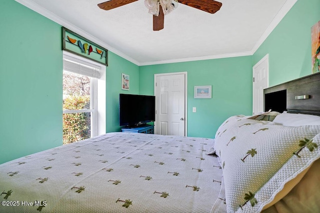 bedroom featuring ceiling fan and ornamental molding