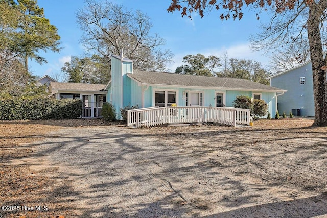 single story home featuring covered porch and central AC