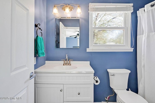 bathroom with toilet and vanity