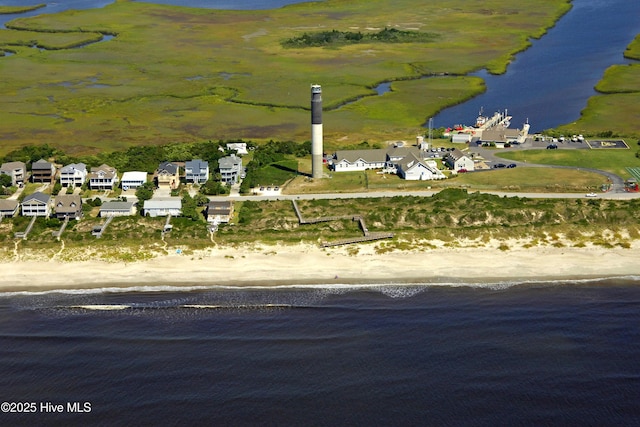 drone / aerial view with a view of the beach and a water view