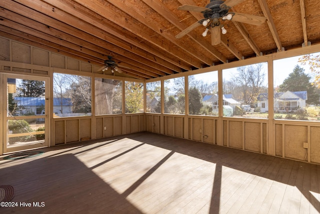 unfurnished sunroom with vaulted ceiling