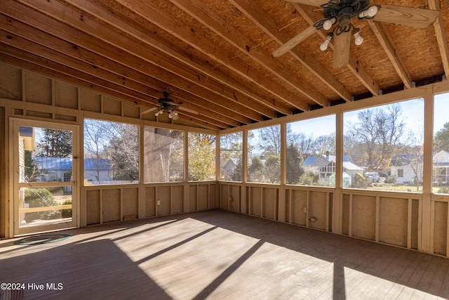 unfurnished sunroom with plenty of natural light and lofted ceiling