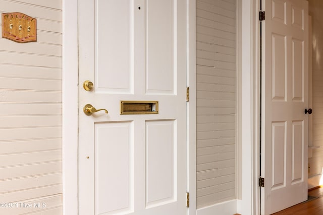 interior details featuring wooden walls