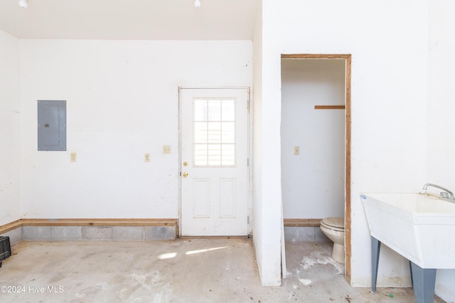 interior space featuring sink and electric panel