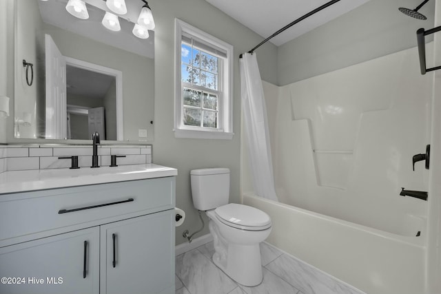 full bathroom with shower / tub combo, vanity, and toilet