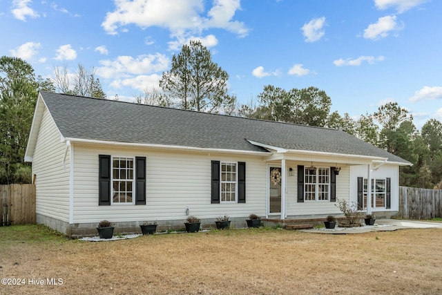 ranch-style home featuring a front yard