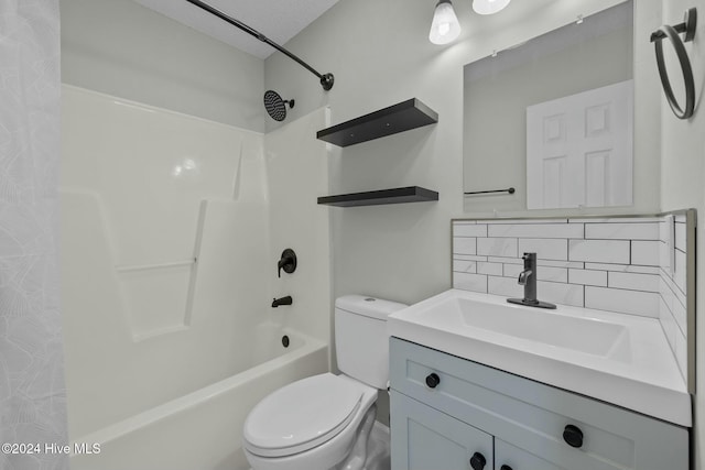 full bathroom with vanity, toilet, bathtub / shower combination, and tasteful backsplash