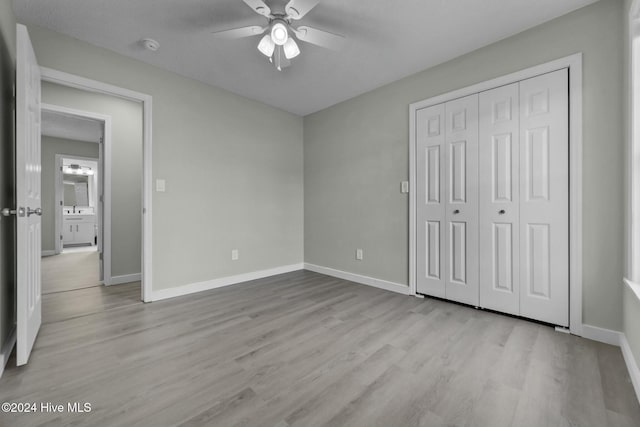 unfurnished bedroom featuring a closet, ceiling fan, and light hardwood / wood-style floors