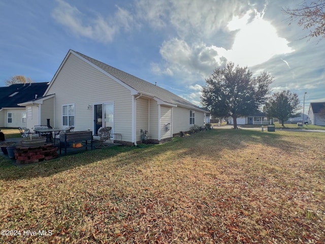 view of property exterior with a lawn