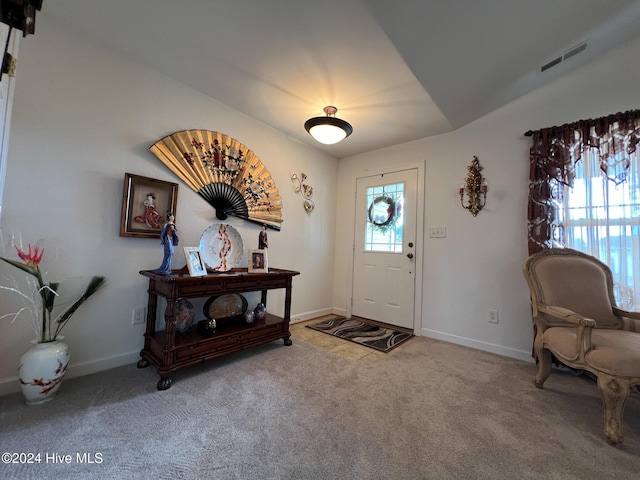 entrance foyer with carpet floors