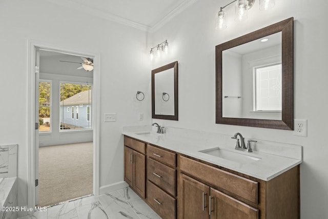 bathroom with ceiling fan, ornamental molding, and vanity