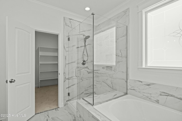 bathroom featuring ornamental molding and independent shower and bath