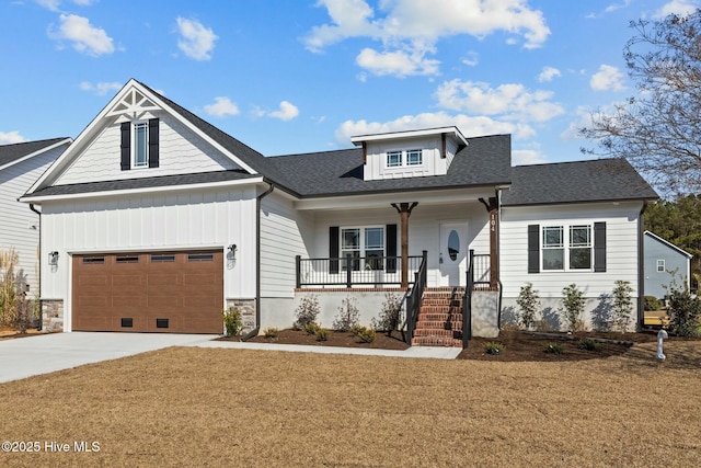 craftsman-style home with a garage, a front lawn, and a porch