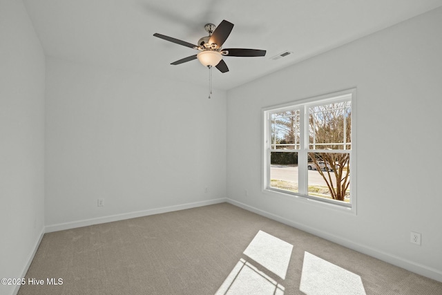 carpeted empty room with ceiling fan