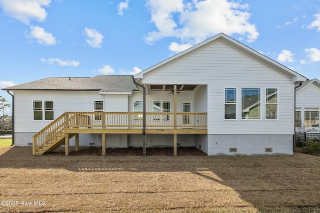 rear view of house with a wooden deck and ceiling fan