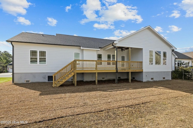 rear view of house featuring a wooden deck and ceiling fan