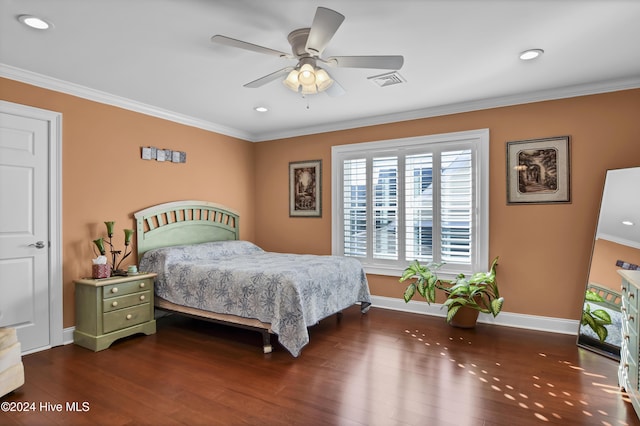 bedroom with dark hardwood / wood-style floors, ceiling fan, and crown molding