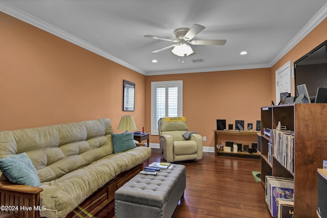 living room with ceiling fan, ornamental molding, and dark wood-type flooring