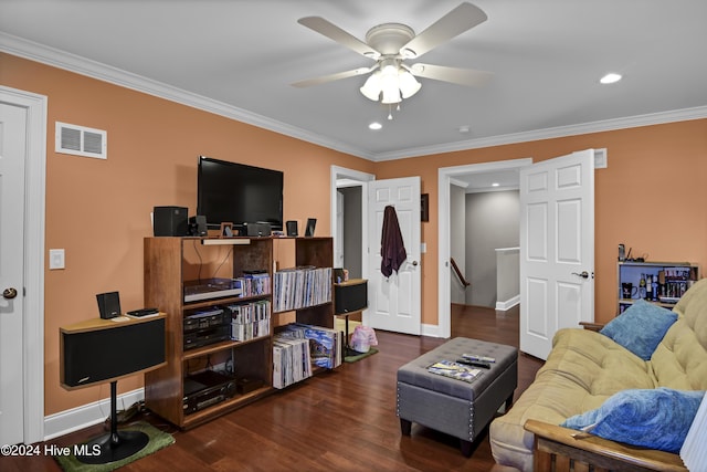 living room with ceiling fan, dark hardwood / wood-style flooring, and ornamental molding