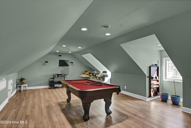 recreation room featuring hardwood / wood-style flooring, lofted ceiling, and pool table