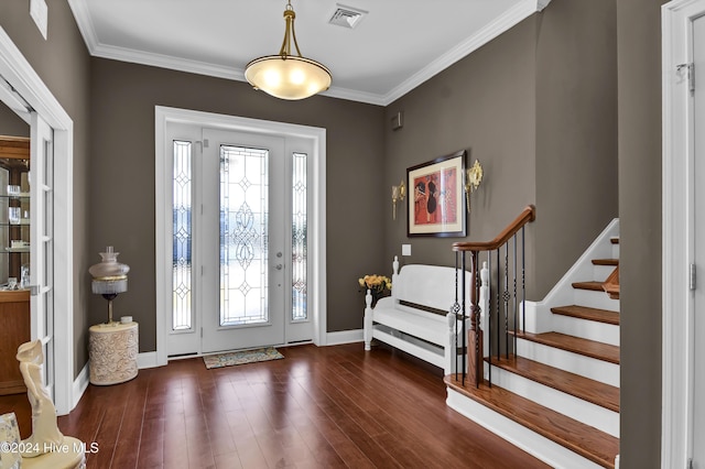 foyer featuring dark hardwood / wood-style floors and ornamental molding