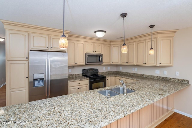 kitchen with sink, stainless steel appliances, light stone counters, dark hardwood / wood-style floors, and decorative light fixtures