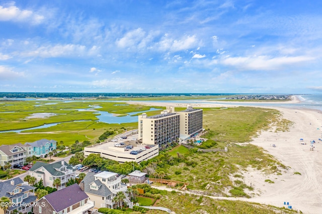 drone / aerial view featuring a water view and a beach view