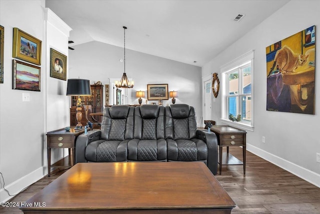 living room featuring dark hardwood / wood-style flooring and lofted ceiling