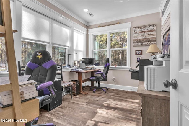 office area with hardwood / wood-style flooring and crown molding