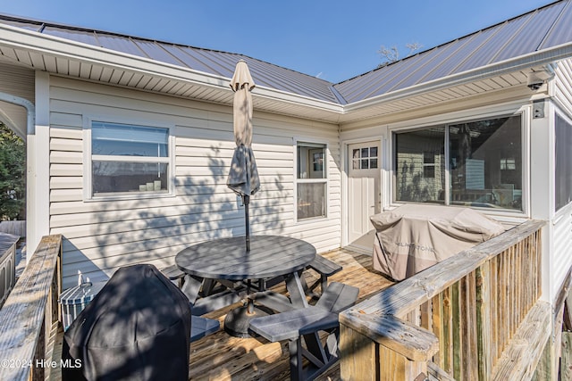 wooden deck with grilling area