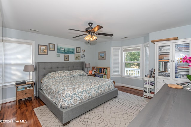 bedroom featuring ceiling fan and dark wood-type flooring