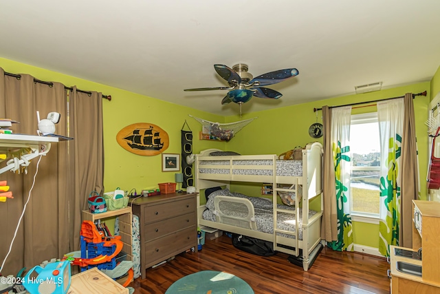 bedroom with ceiling fan and dark wood-type flooring